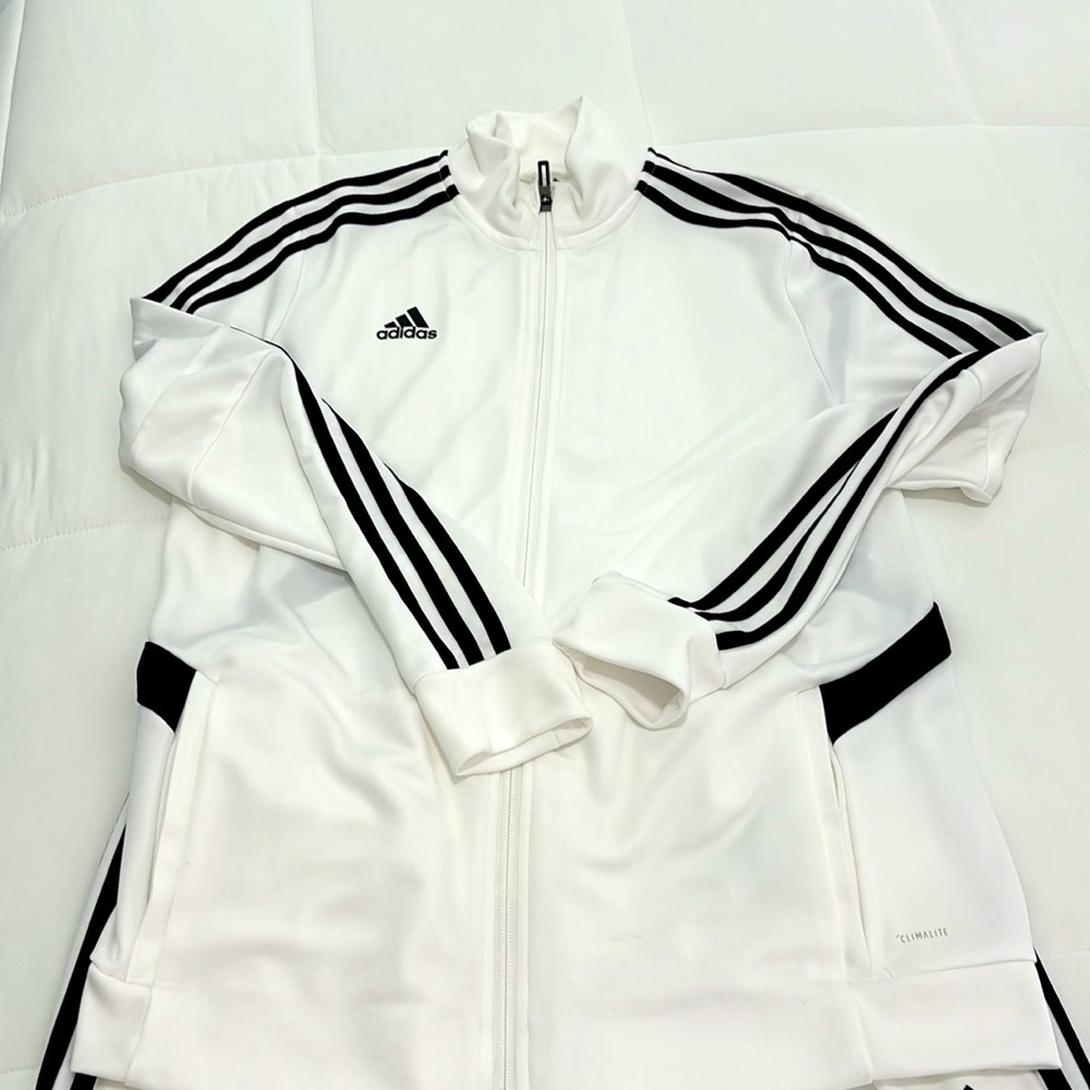 Adidas Women’s Track Suit size Large. Both zip up and pants included.